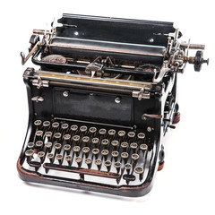 Old rusty and dusty typewriter on white background
