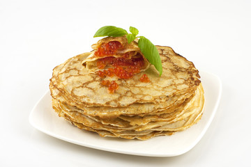 pancakes with caviar on a whote plate