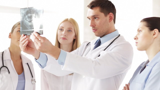 two doctors with x-ray prints
