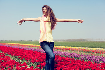 woman in red tulip field