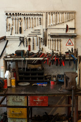many dirty tools on table and dashboard