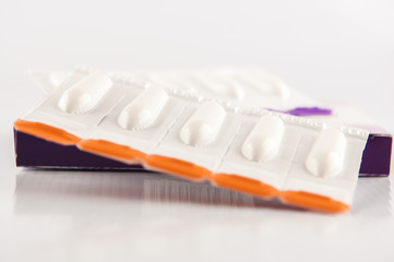Suppository tablet on white background
