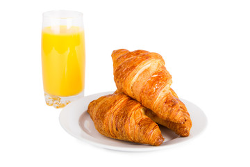 Croissants and glass of orange juice
