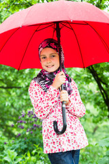 Little muslim girl with umbrela
