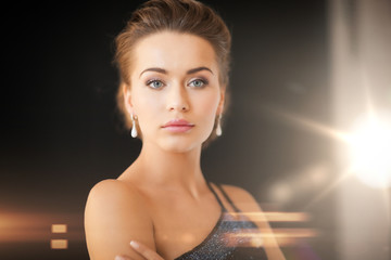 woman with diamond earrings