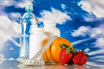 Fitness objects on the blue sky background