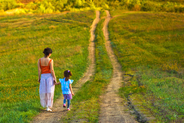 mother woman little girl my daughter go on rural road through gr