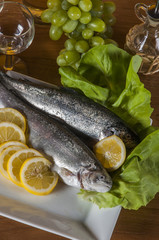 Raw, whole trout, mediterranean theme