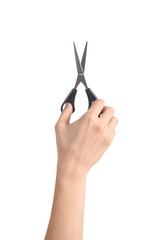 Vertical view of a woman hand using a scissors