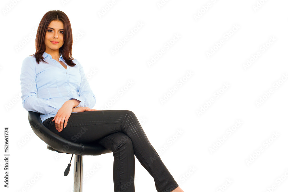 Wall mural happy young business woman sitting on the modern chair