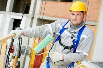 Portrait of builder facade painter at work