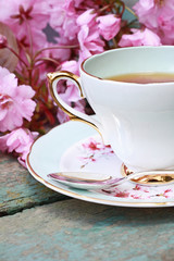 Fototapeta premium Beautiful japanese cherry tree and a cup of tea