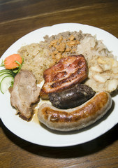 typical food Slovenia black pudding fried sausage dried pork cho