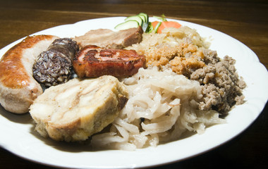 typical food Slovenia black pudding fried sausage dried pork cho