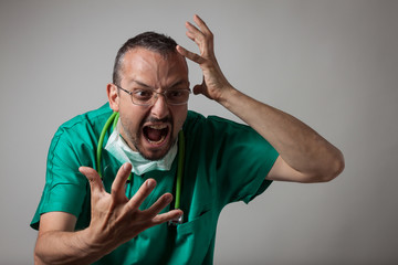 Portrait of a young physician shouting