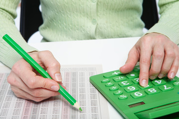 Businesswoman working with calculator