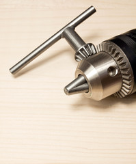 closeup of electric drill and wood