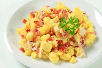 Small potato dumplings with bacon and cabbage