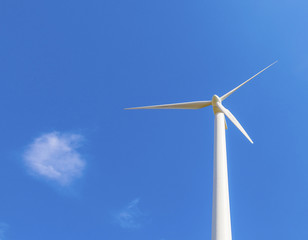 wind turbine generating electricity on blue sky