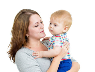 mother embracing baby boy isolated on white