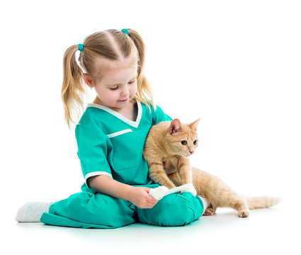 Cute kid playing doctor with cat isolated