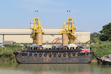 Fototapeta premium ship and port with loading sacks rice.