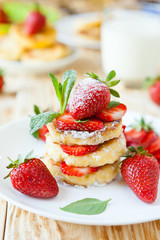 curd pancake with strawberries and milk