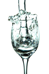 stream of water falling into the glass.