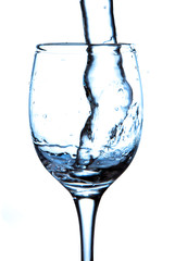 stream of water falling into the glass.