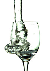 stream of water falling into the glass.