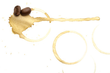 Coffee background, beans and traces of coffee on paper