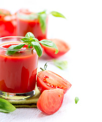 Tomato Juice and Fresh Tomatoes isolated on a White Background