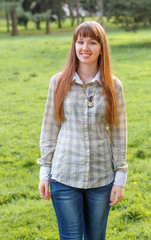 Obraz premium The girl on a green background.