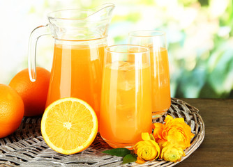 Glasses and pitcher of orange juice