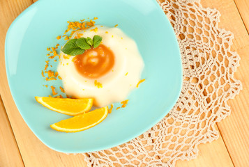 Panna Cotta with orange zest and caramel sauce,