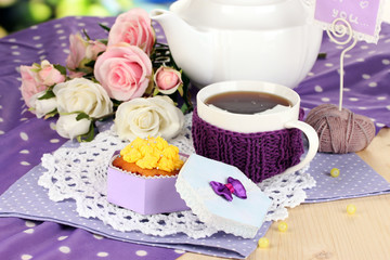 Delicious beautiful  cupcake on dining table close-up