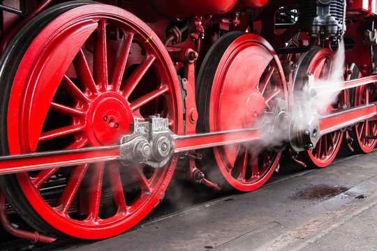 Red wheels of a historic stem train