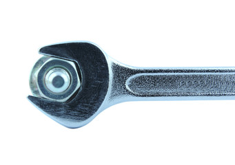 Detail of chrome wrench turning a nut on a bolt