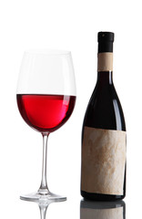 Glass of wine with bottle isolated on white