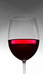 Glass of wine on gray background