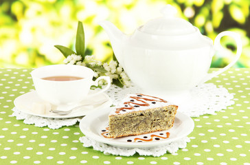 Delicious poppy seed cake with cup of tea