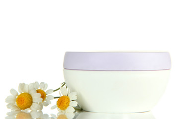 Fototapeta na wymiar Cosmetic cream with wild camomiles, isolated on white