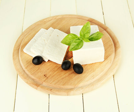 Sheep milk cheese, black olives, with basil