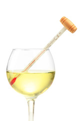 Glass of wine with thermometer, isolated on white