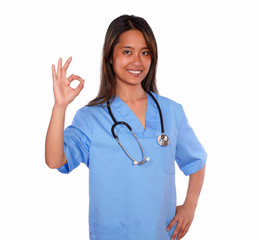 Charming asiatic nurse woman showing you ok sign