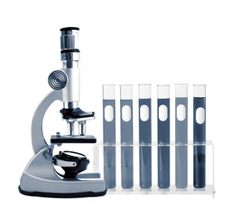 Medical test tubes with blood in holder and microscope on white