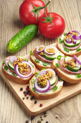 Sandwiches with sausage and onion