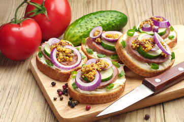 Sandwiches with sausage and onion