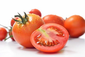 Fresh tomatoes isolated on white
