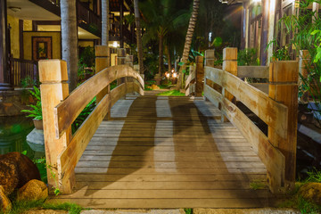 wooden bridge in the light of lanterns